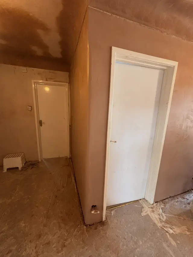 Orange plaster finish in small room